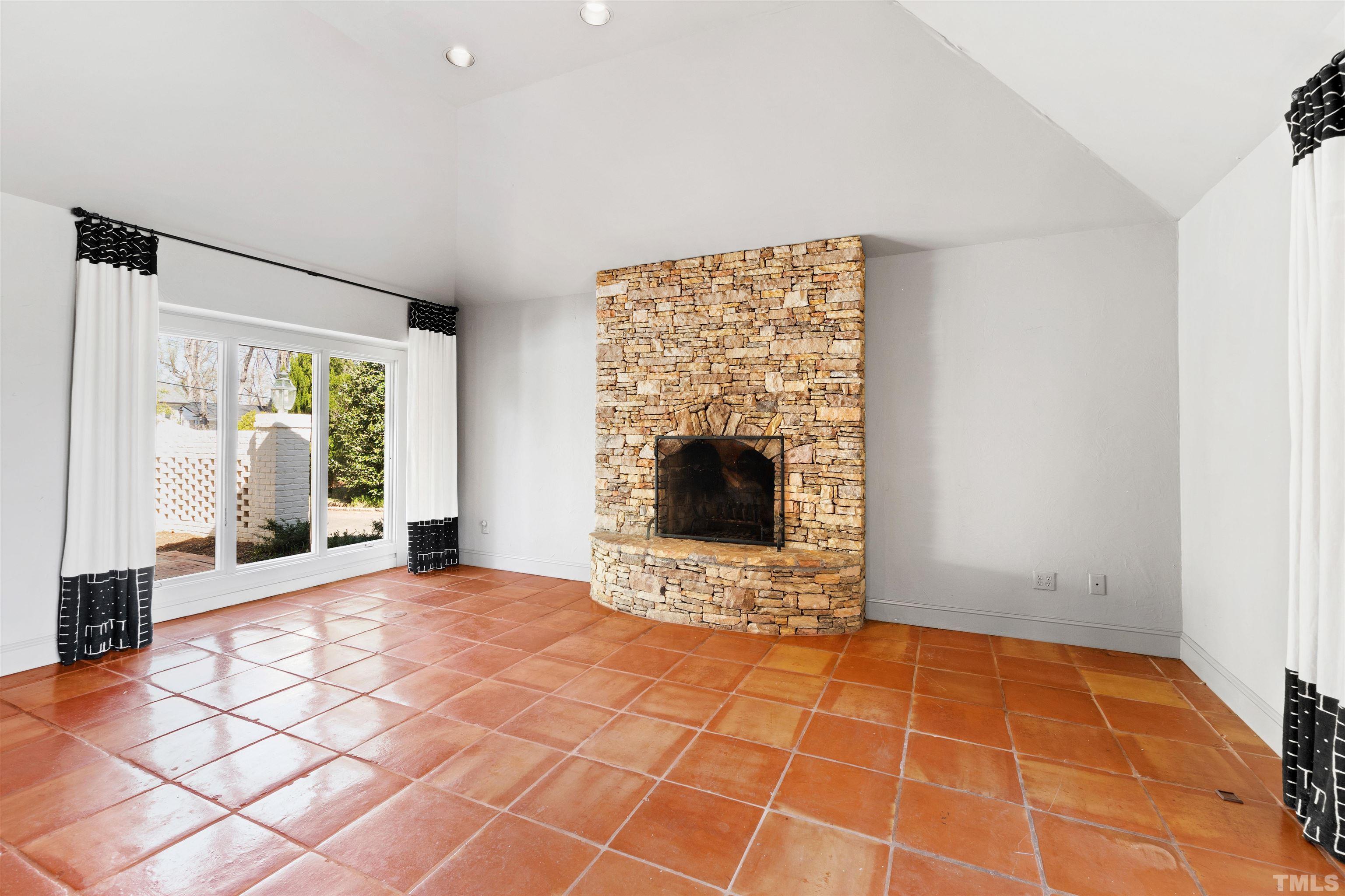 1718 Canterbury Road Raleigh, NC 27608 - Photo 19 of 30 a view of an empty room with glass door and glass door