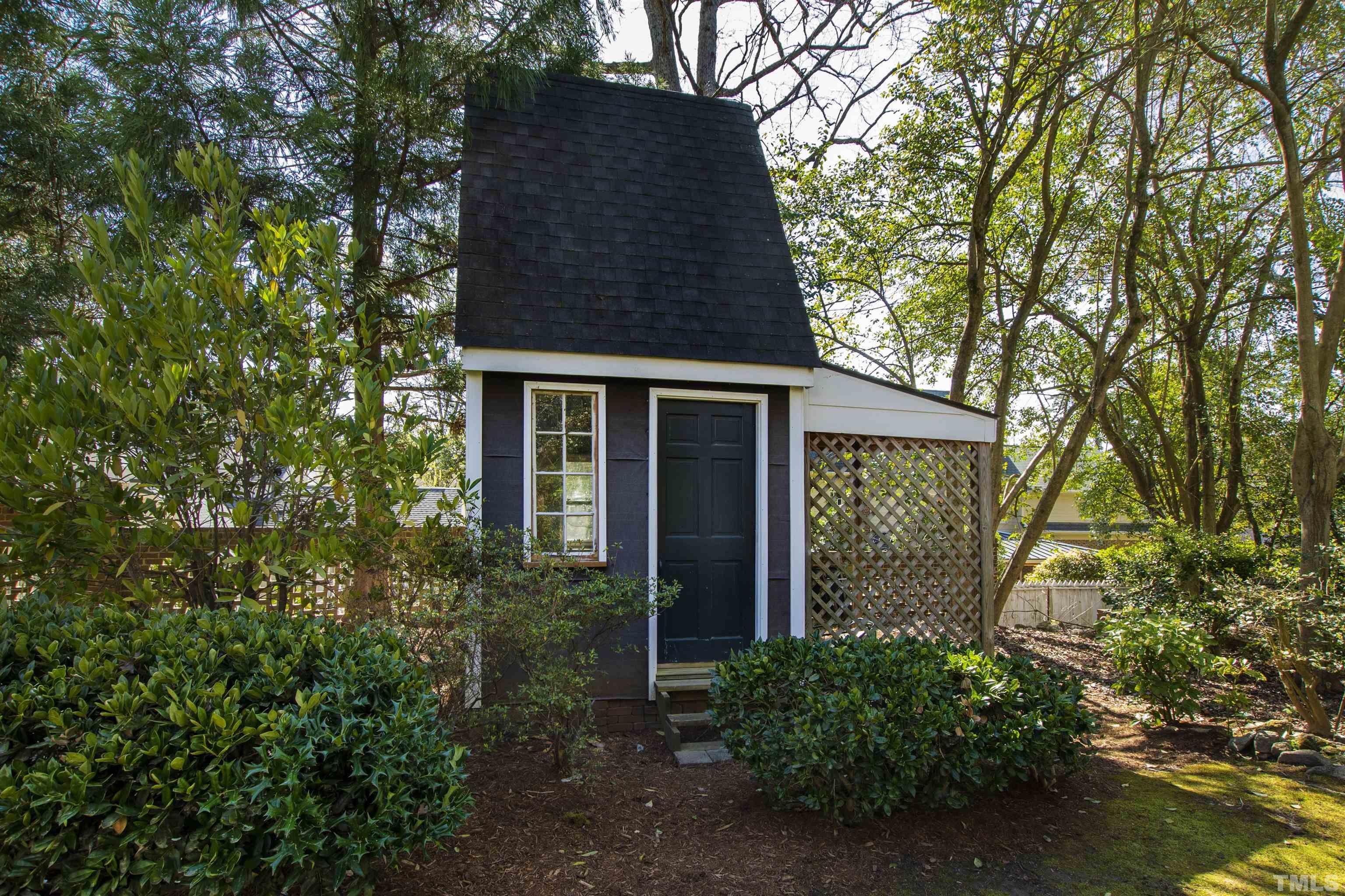 1718 Canterbury Road Raleigh, NC 27608 - Photo 28 of 30 front view of a house with a tree