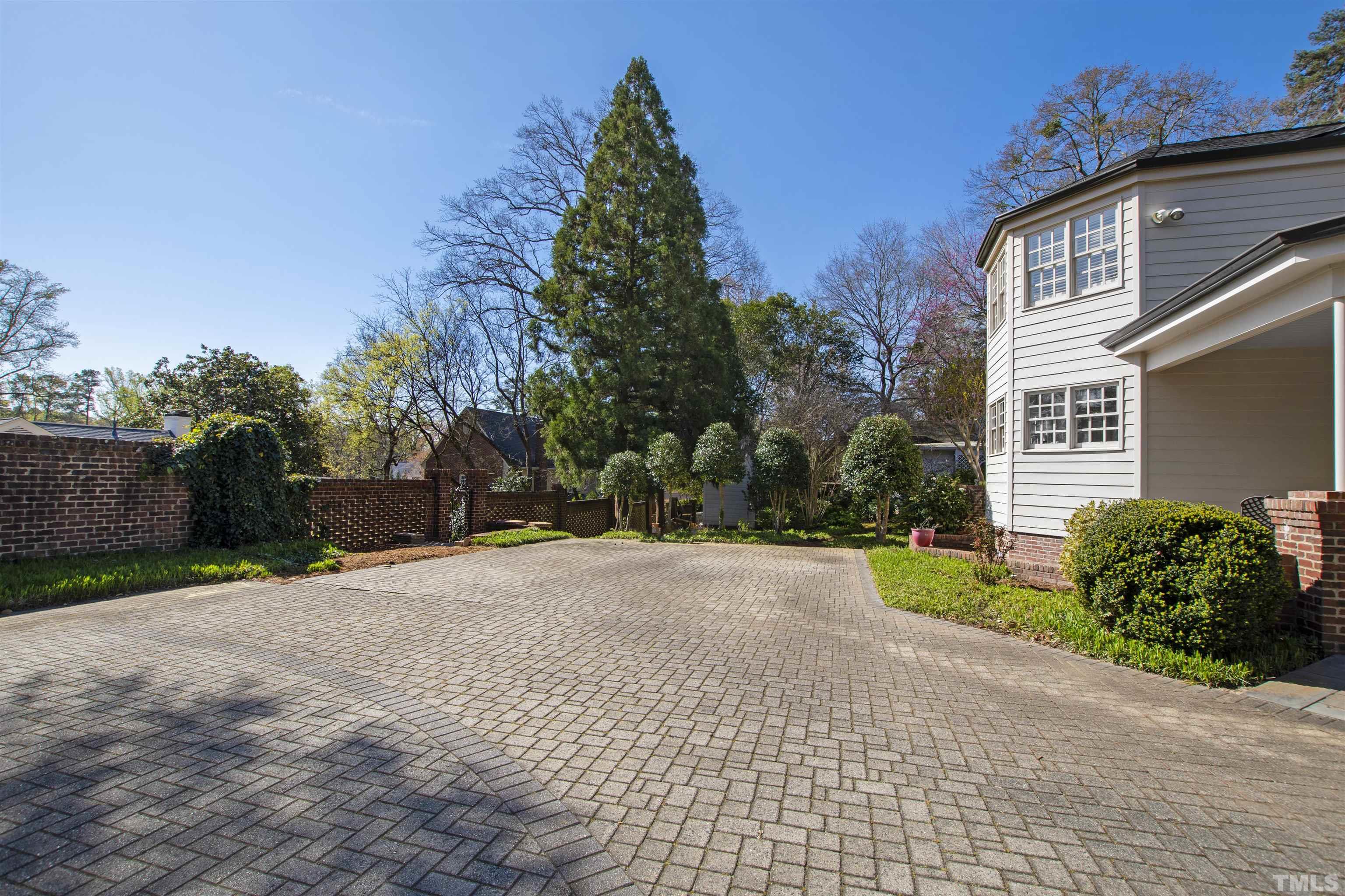 1718 Canterbury Road Raleigh, NC 27608 - Photo 29 of 30 a pathway of a house with a yard