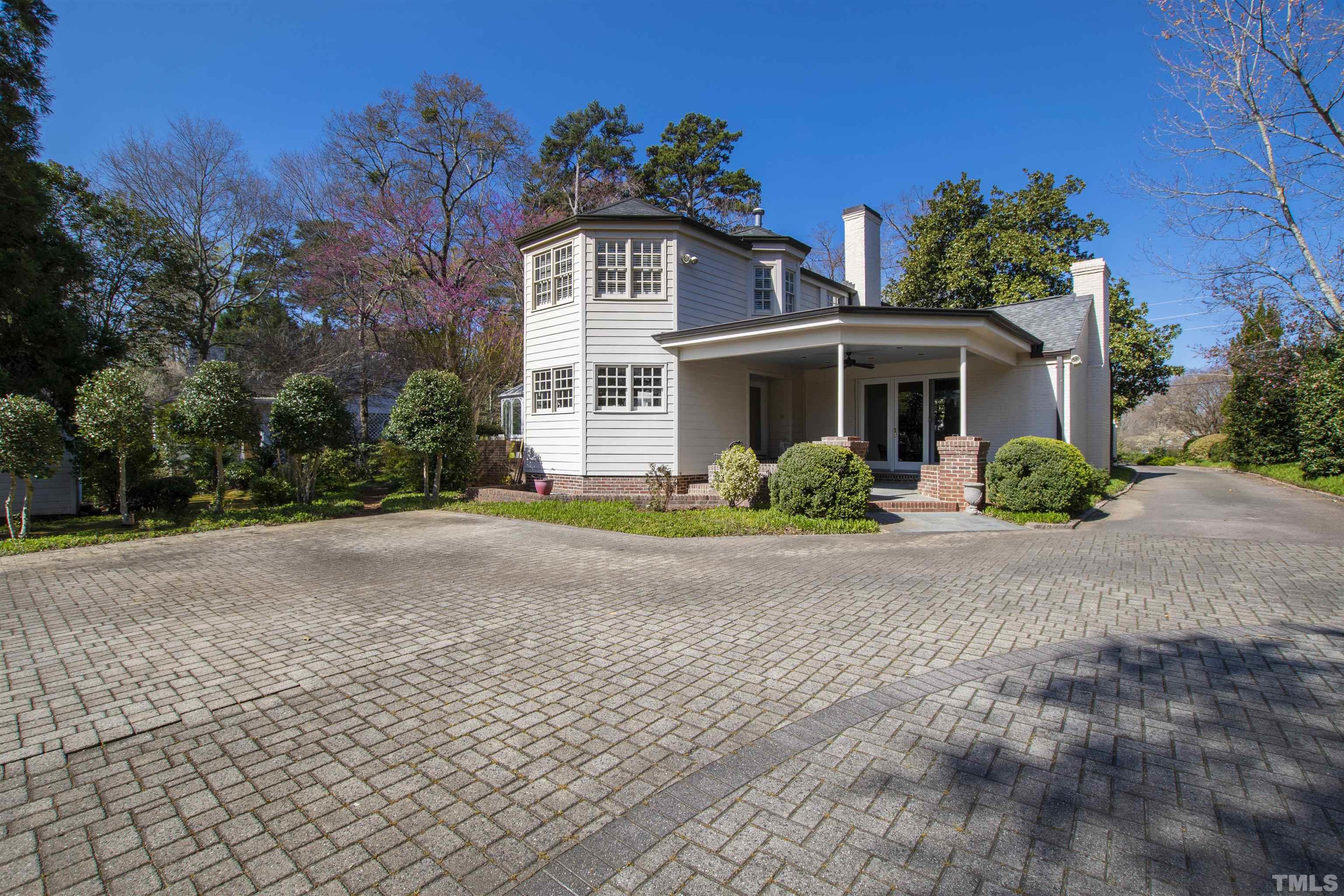 1718 Canterbury Road Raleigh, NC 27608 - Photo 30 of 30 a front view of a house with a yard and a garage