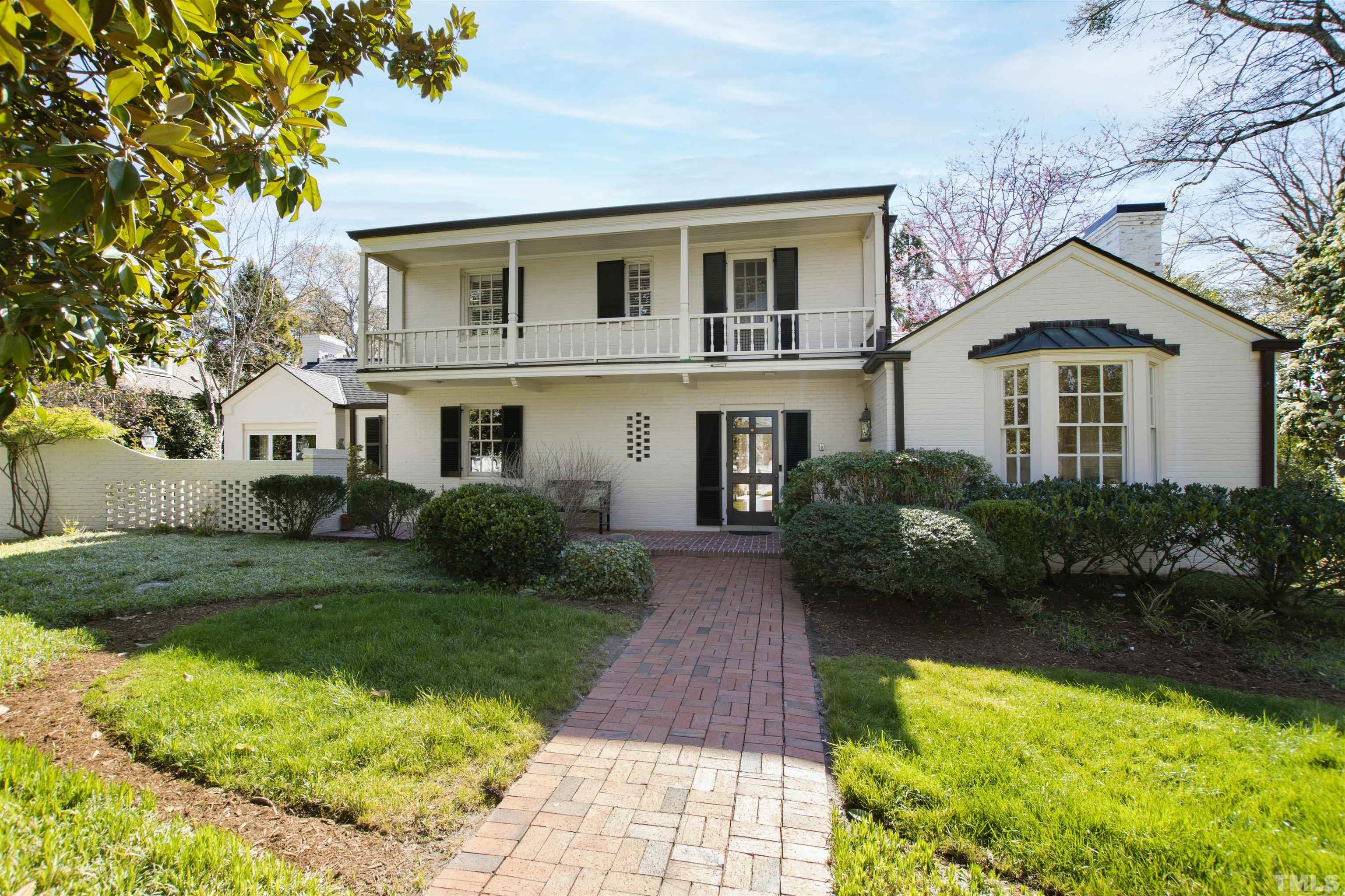 1718 Canterbury Road Raleigh, NC 27608 - Photo 3 of 30 a front view of a house with a yard