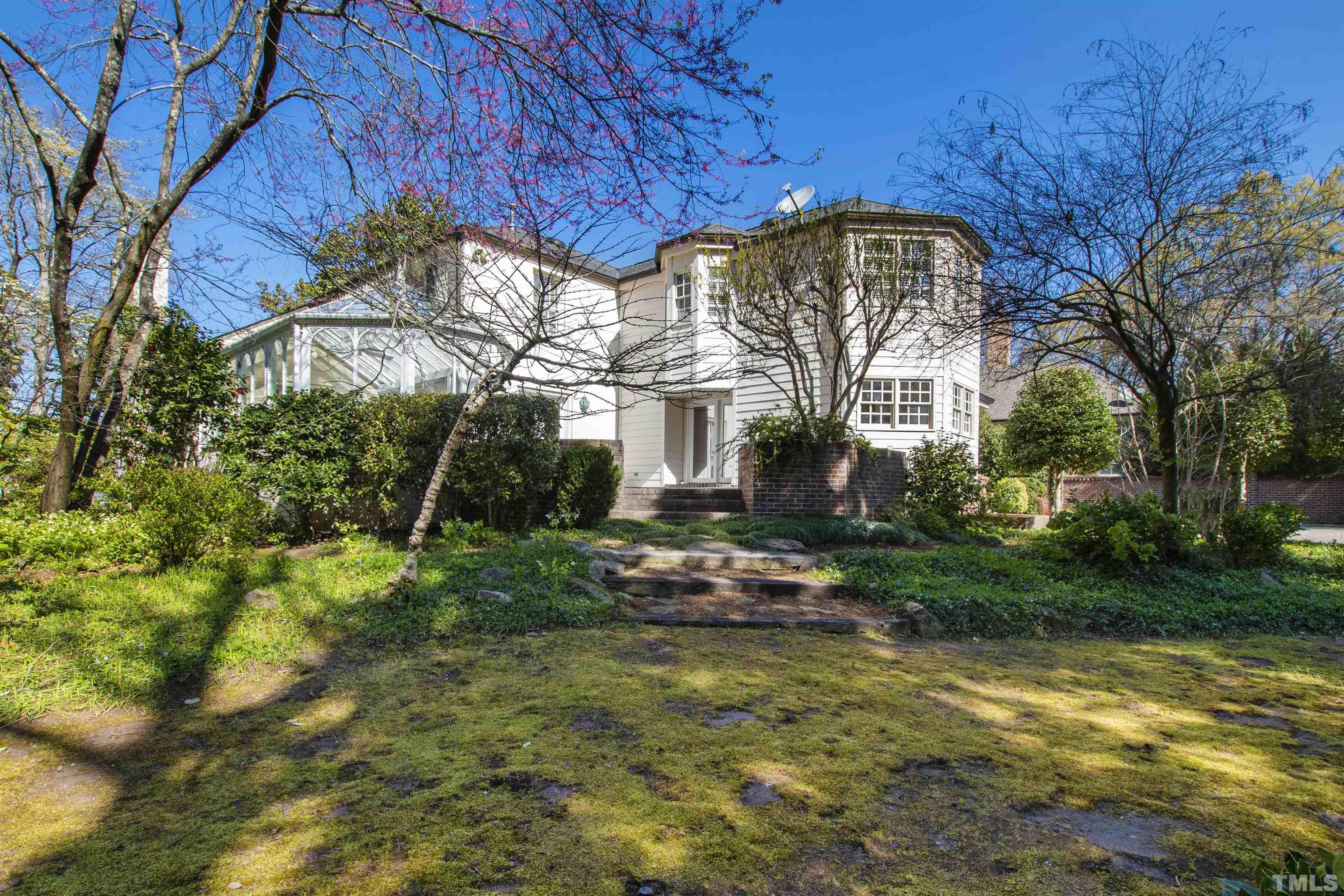 1718 Canterbury Road Raleigh, NC 27608 - Photo 4 of 30 a view of a house with a yard