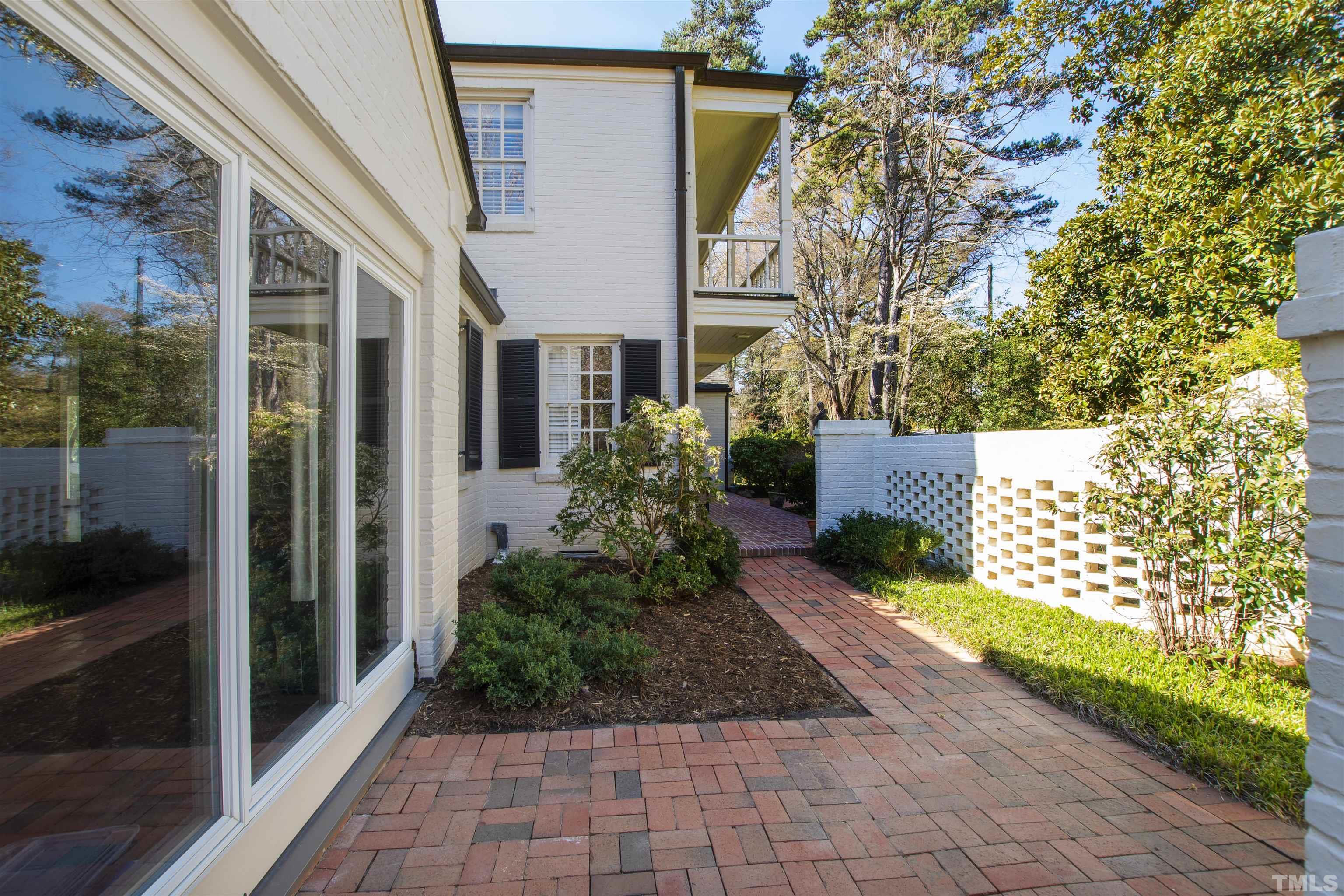 1718 Canterbury Road Raleigh, NC 27608 - Photo 5 of 30 a view of a house with a yard