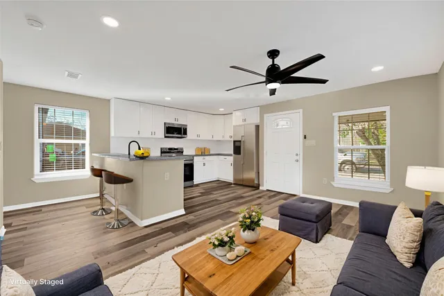 a living room with furniture and a window