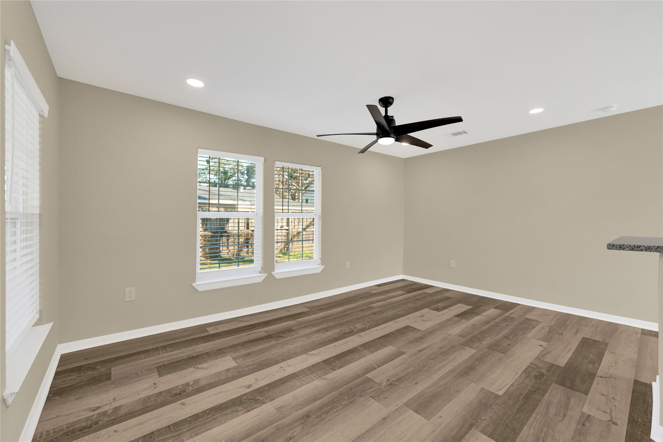 7814 Avenue F Houston, TX 77012 - Photo 11 of 28 a view of a livingroom with a ceiling fan & a window