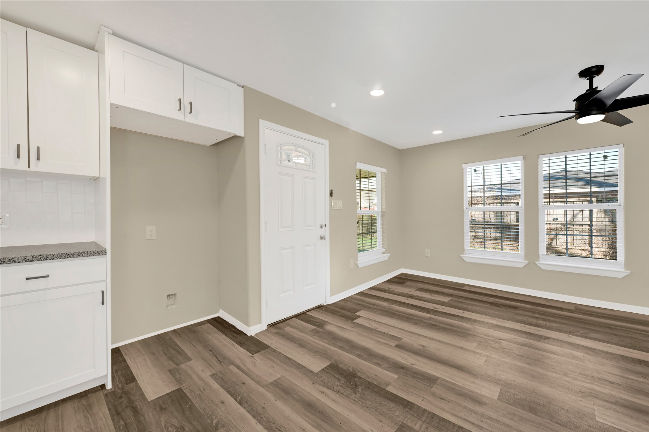 7814 Avenue F Houston, TX 77012 - Photo 14 of 28 a view of an empty room with a window and wooden floor