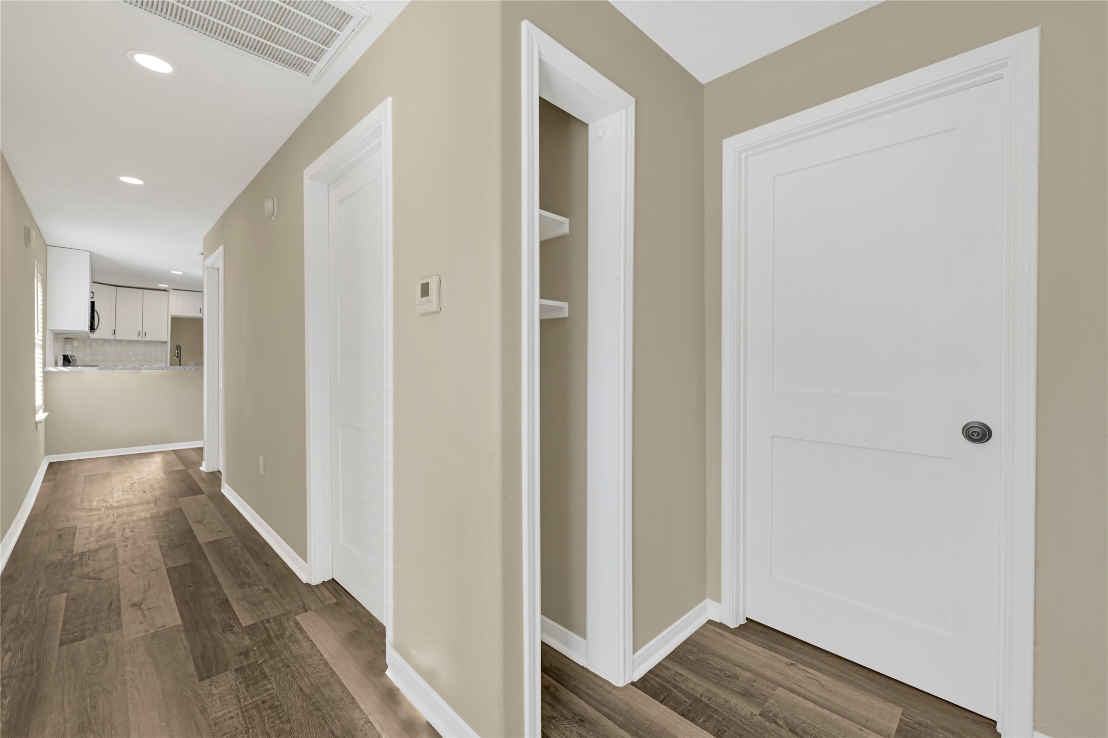 7814 Avenue F Houston, TX 77012 - Photo 16 of 28 a view of hallway with wooden floor