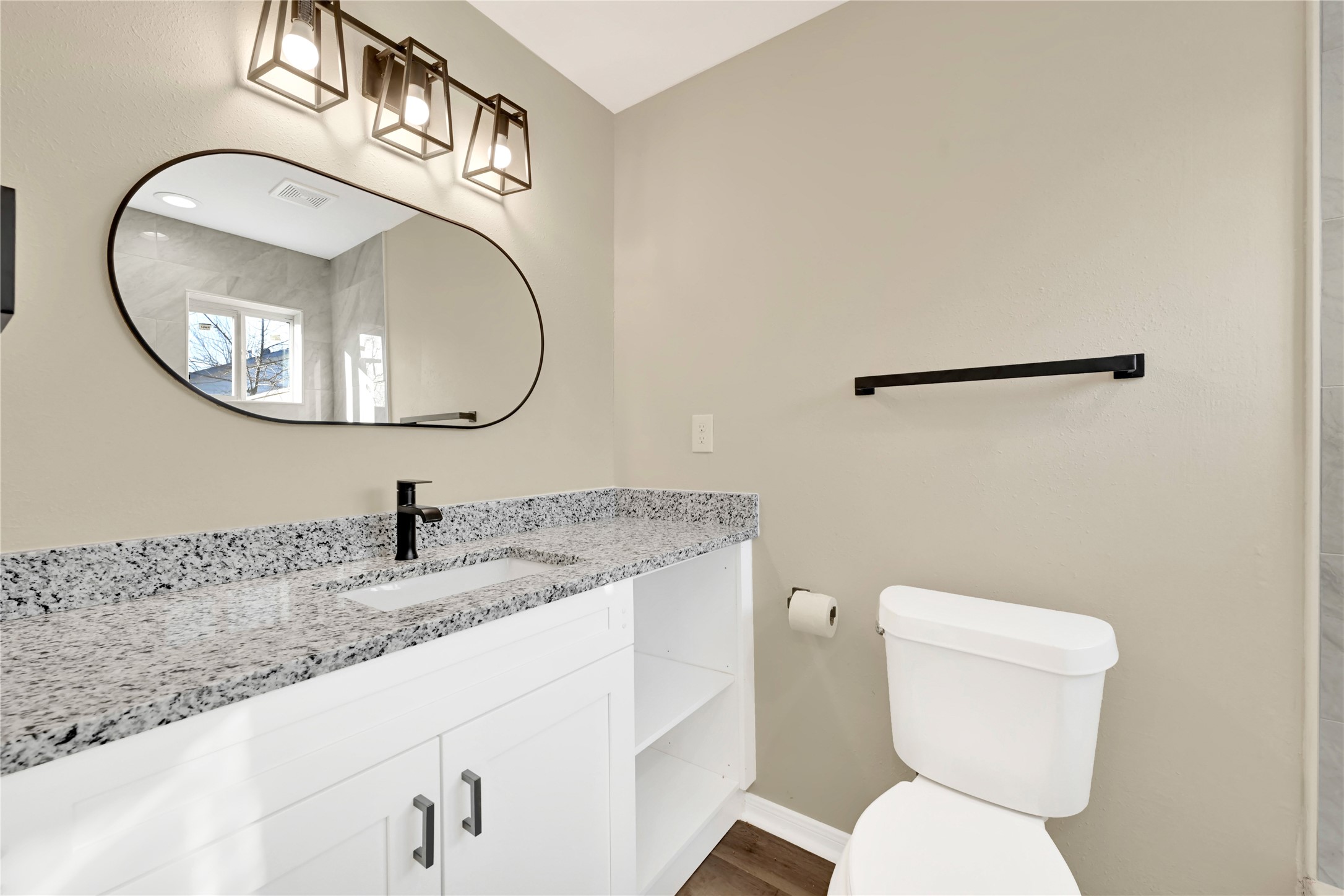 7814 Avenue F Houston, TX 77012 - Photo 17 of 28 a bathroom with a toilet and a sink