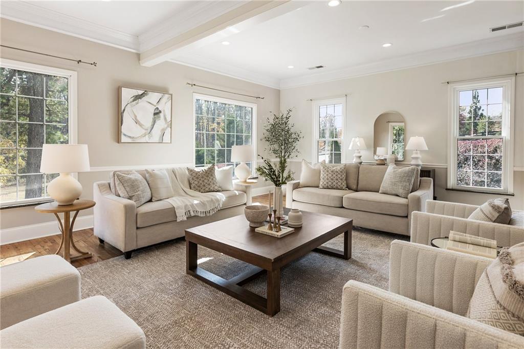 14440 Cogburn Road Alpharetta, GA 30004 - Photo 21 of 62 a living room with furniture a large window and a table