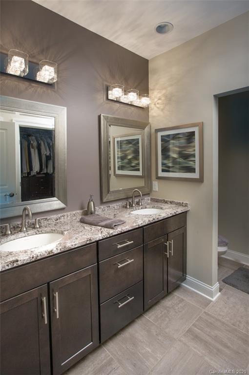 2018 New Style Way, Unit 5 Tega Cay, SC 29708 - Photo 2 of 36 a bathroom with double vanity sink and a mirror