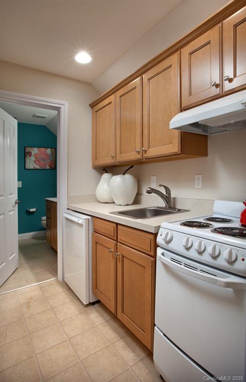 2018 New Style Way, Unit 5 Tega Cay, SC 29708 - Photo 16 of 36 a kitchen with cabinets appliances and a sink