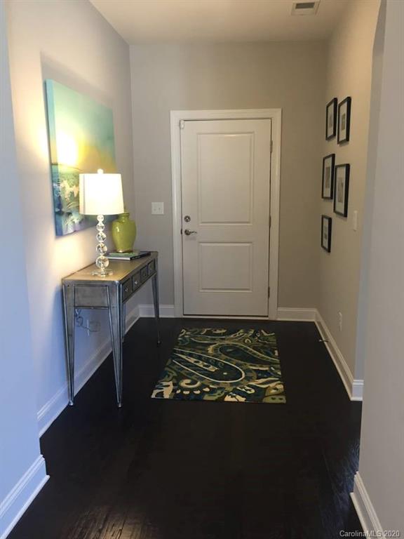2018 New Style Way, Unit 5 Tega Cay, SC 29708 - Photo 21 of 36 a bedroom with a bed and a table in it