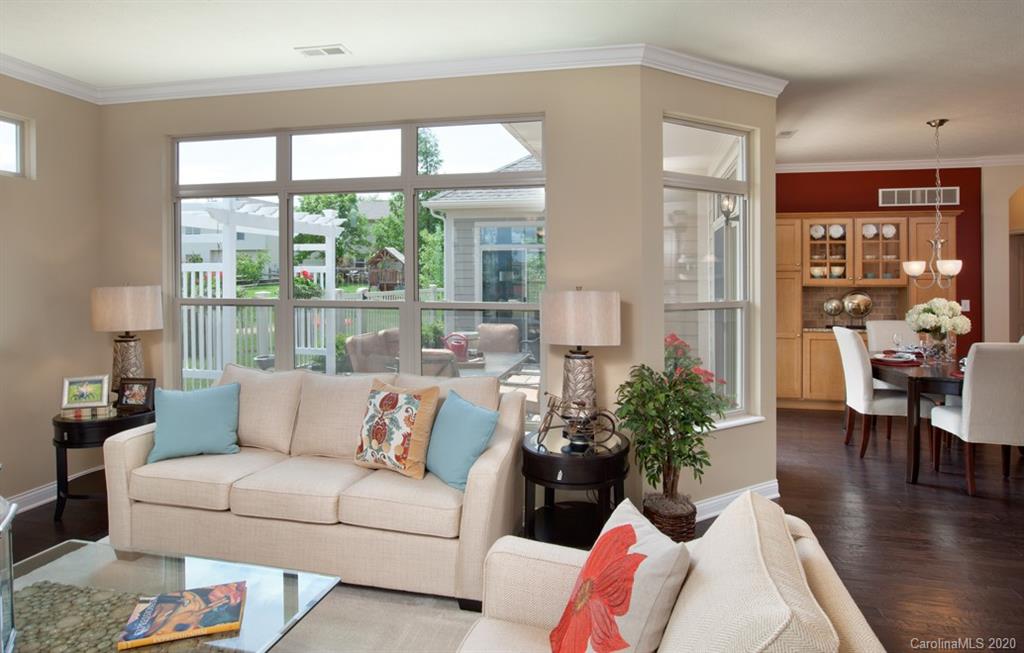 2018 New Style Way, Unit 5 Tega Cay, SC 29708 - Photo 26 of 36 a living room with furniture and a large window