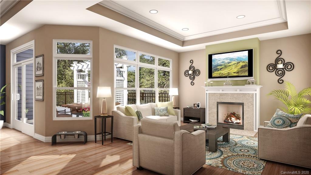 2018 New Style Way, Unit 5 Tega Cay, SC 29708 - Photo 29 of 36 a living room with furniture a fireplace and a flat screen tv