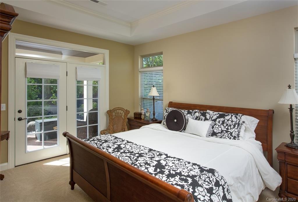 2018 New Style Way, Unit 5 Tega Cay, SC 29708 - Photo 6 of 36 a bedroom with a large bed and a large window