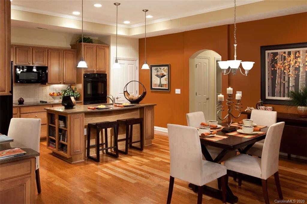 2018 New Style Way, Unit 5 Tega Cay, SC 29708 - Photo 10 of 36 a view of a dining room with furniture