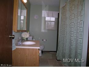 1240 Moody Ridge Road Belpre, OH 45714 - Photo 14 of 15 1st Floor Bath opens to master