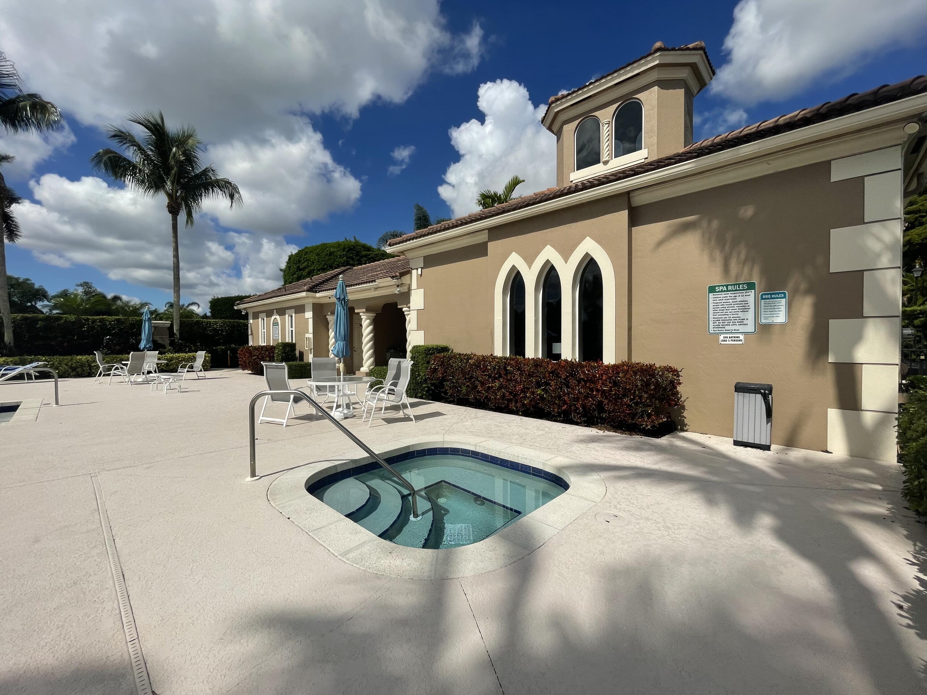16075 Sims Road, Unit 203 Delray Beach, FL 33484 - Photo 17 of 20 a view of a house with backyard and swimming pool