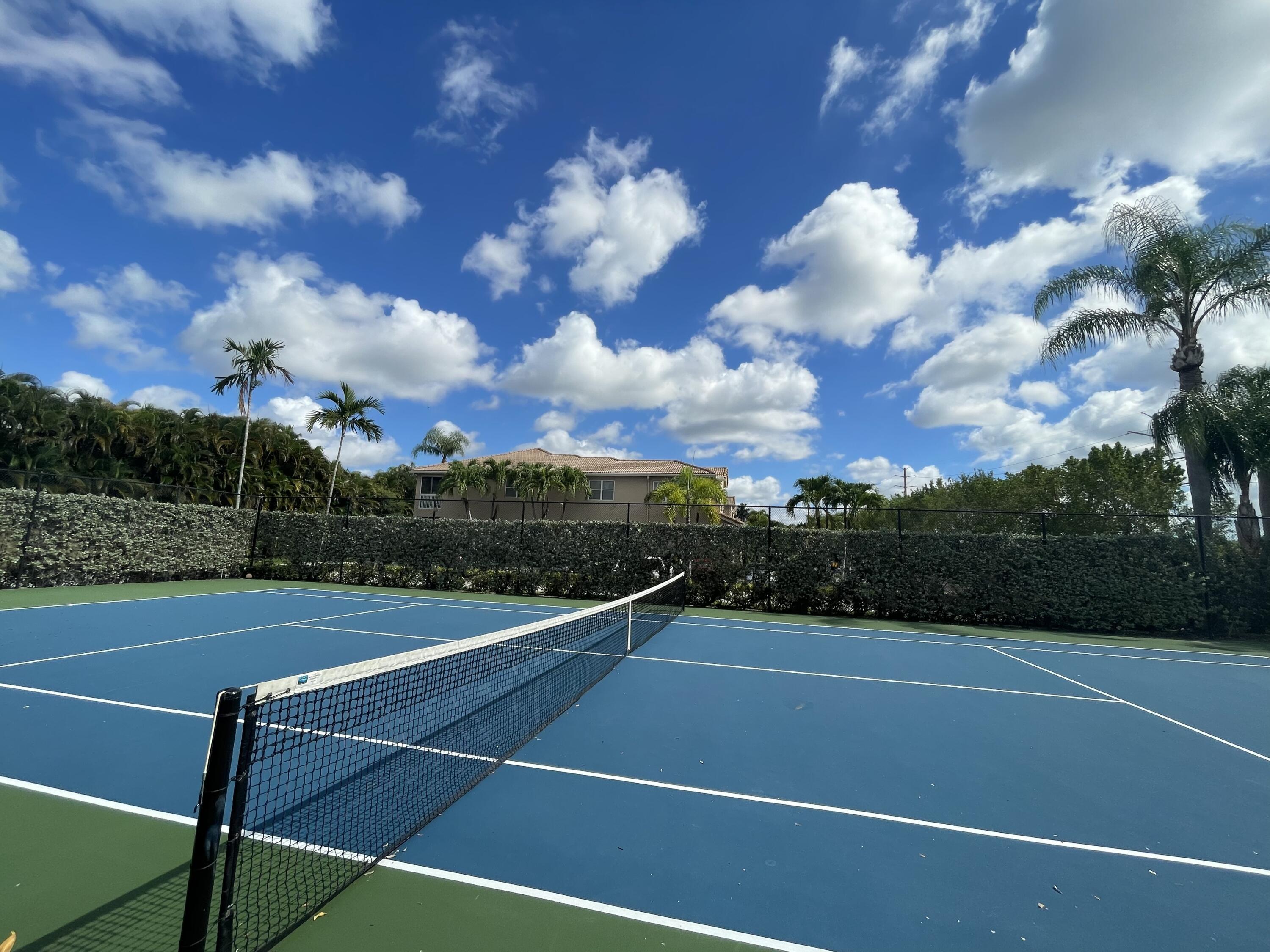 16075 Sims Road, Unit 203 Delray Beach, FL 33484 - Photo 18 of 20 a view of a tennis court