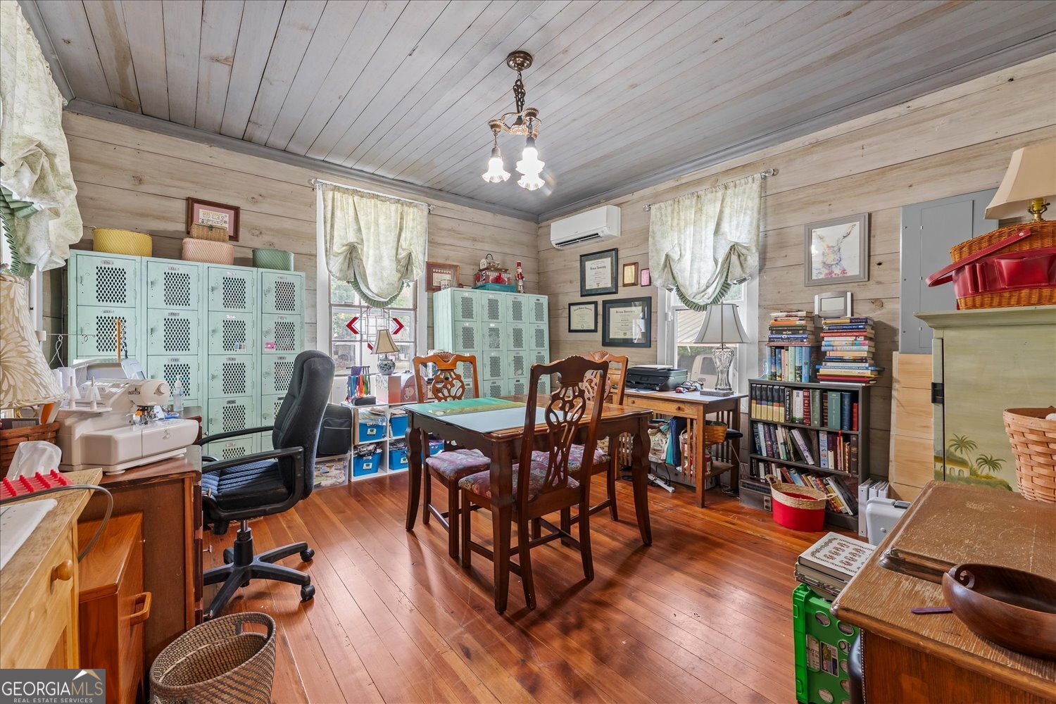 6644 East Cadley Road Norwood, GA 30821 - Photo 15 of 53 a view of a dining room with furniture window and wooden floor