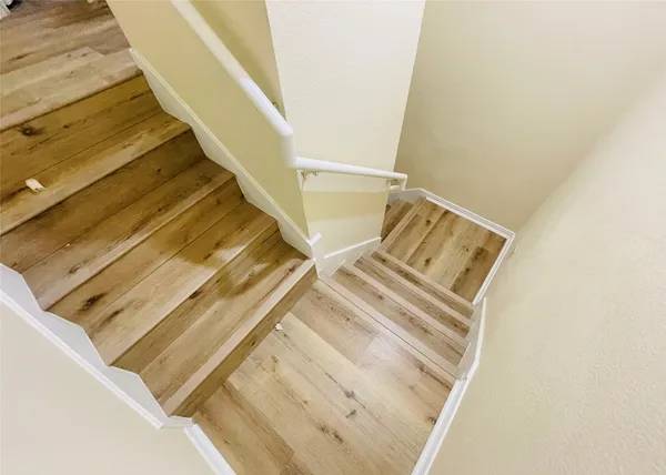a kitchen with a refrigerator sink and stove