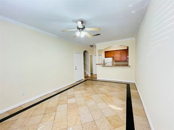 a kitchen with a refrigerator a stove a sink and a cabinets