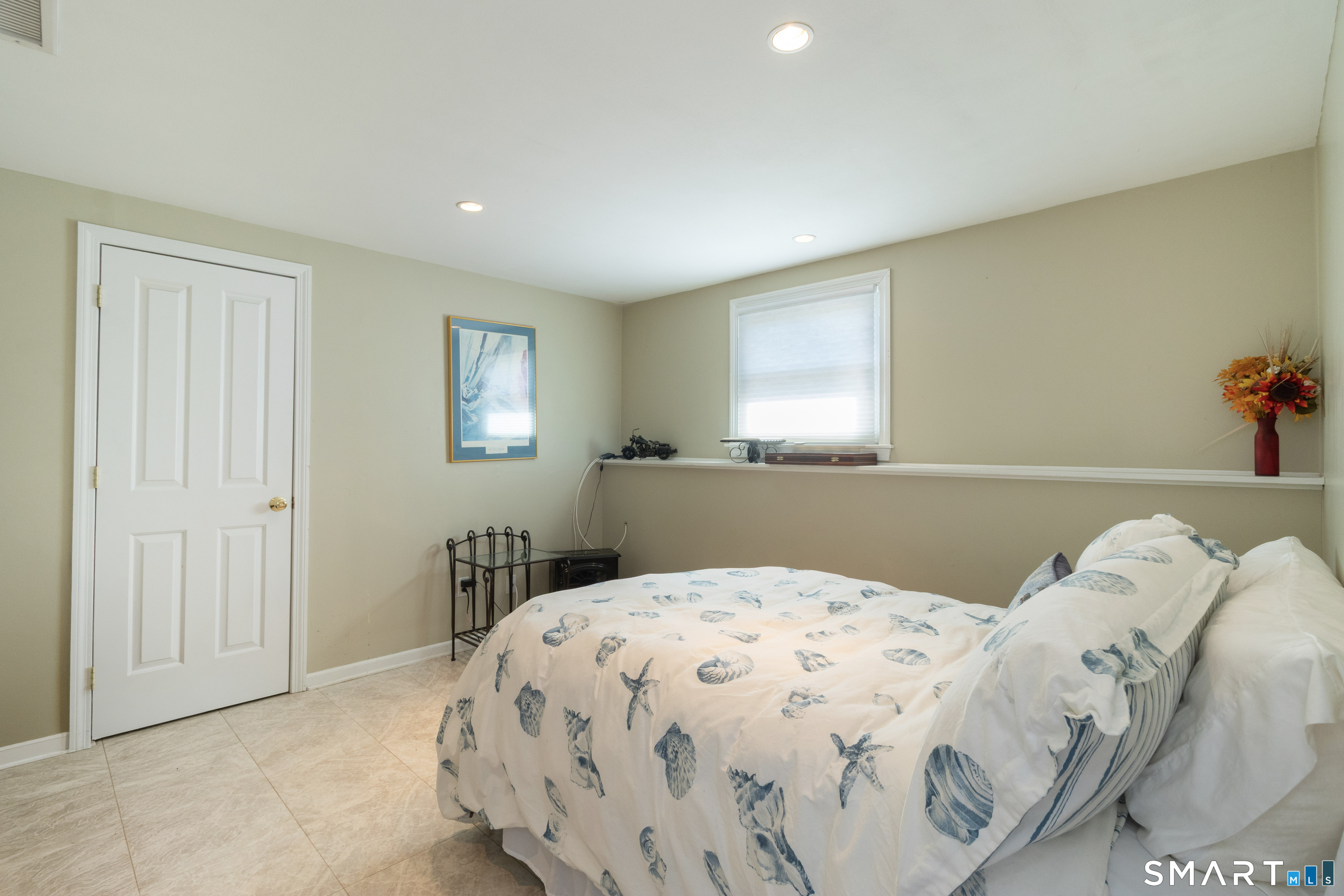 24 Indian Drive Clinton, CT 06413 - Photo 17 of 35 This bedroom is on the lower finished level with full sized windows and access to a full bath.