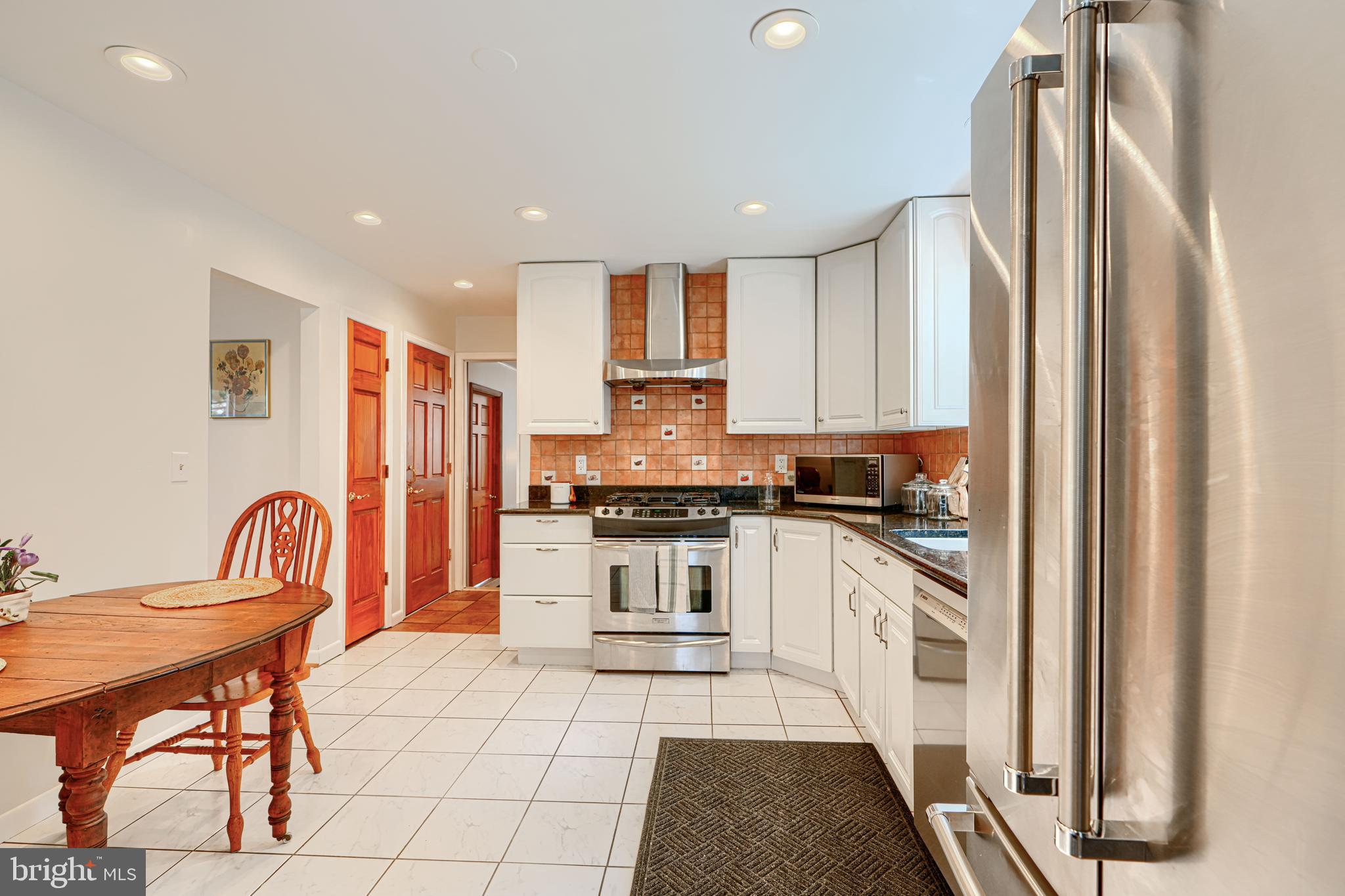 1202 Vermont Road Bel Air, MD 21014 - Photo 13 of 66 a kitchen with stainless steel appliances granite countertop a refrigerator and a stove top oven