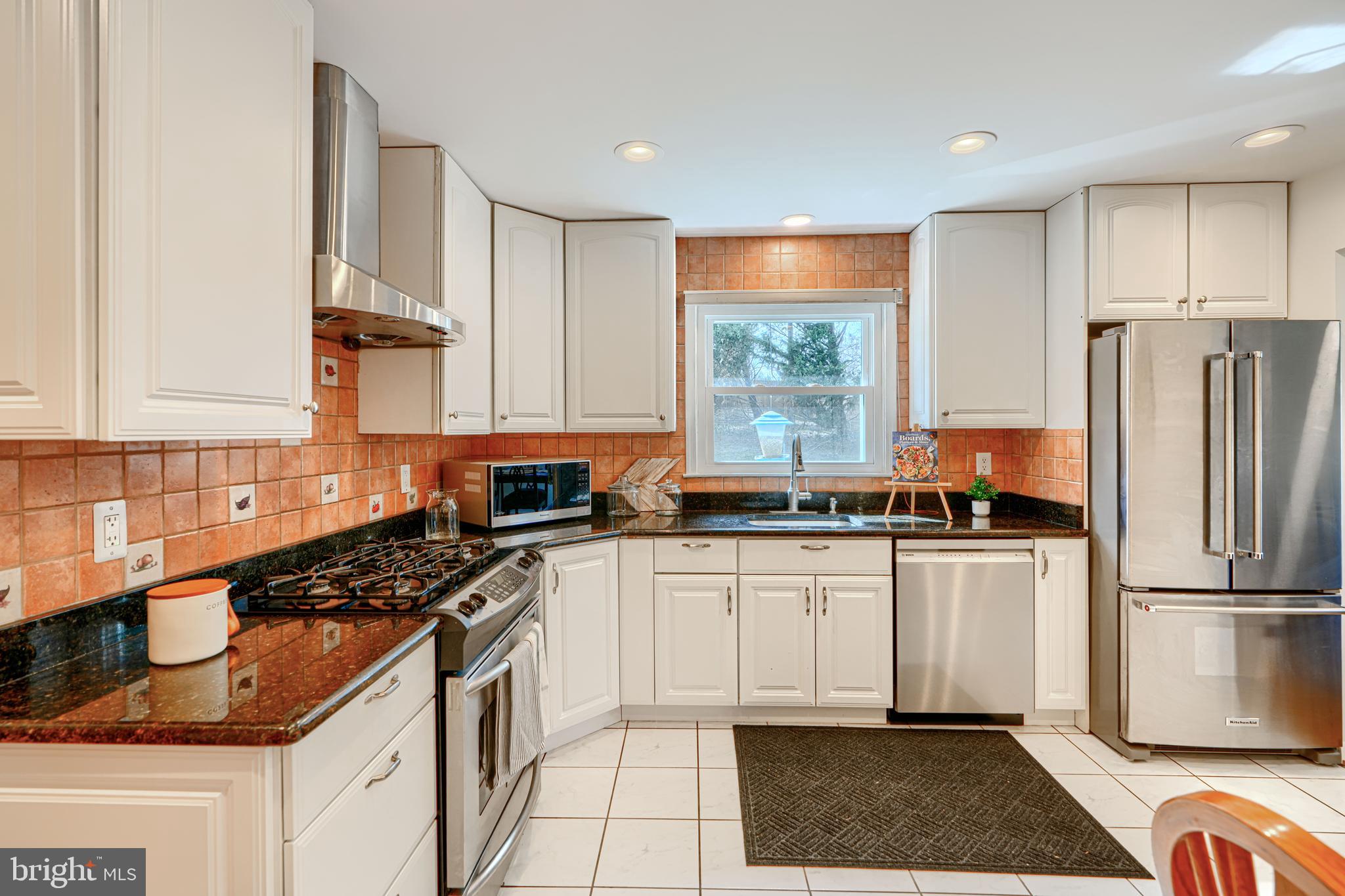 1202 Vermont Road Bel Air, MD 21014 - Photo 15 of 66 a kitchen with stainless steel appliances granite countertop a stove a sink and a refrigerator