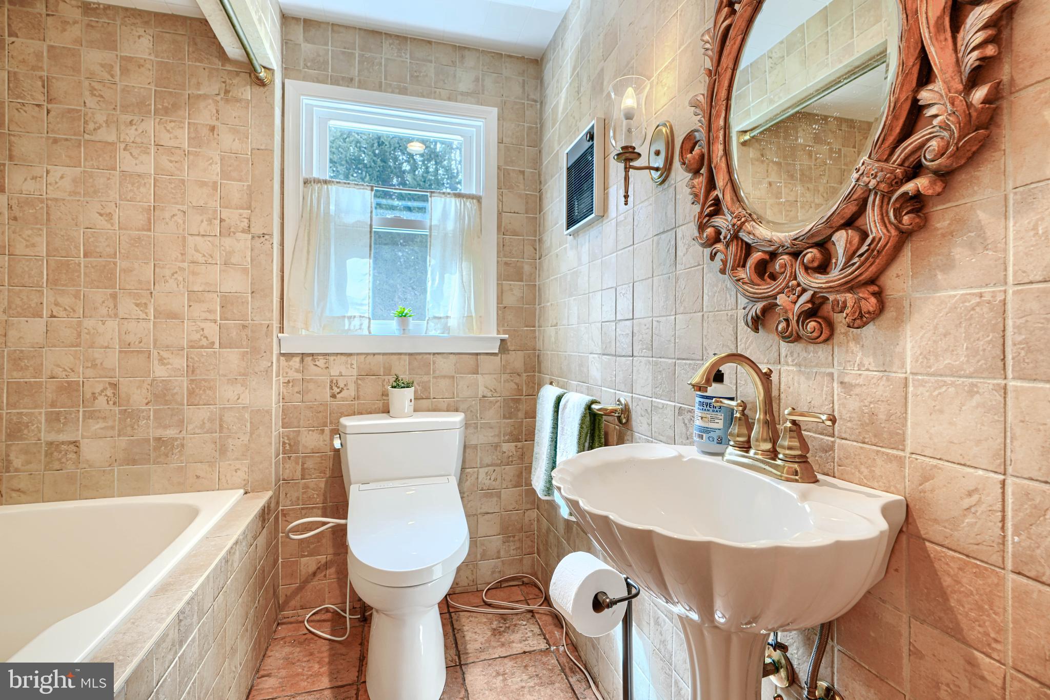 1202 Vermont Road Bel Air, MD 21014 - Photo 21 of 66 a bathroom with a sink a toilet and a bathtub