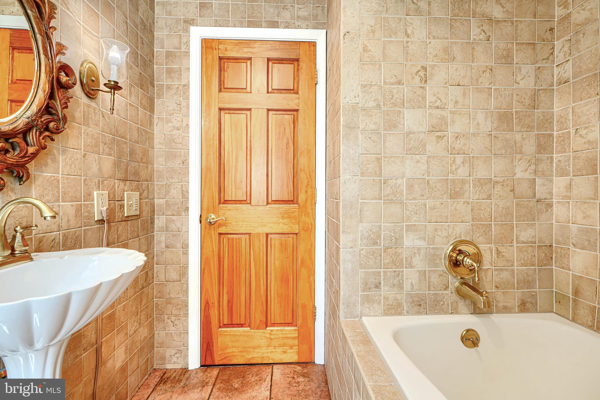 1202 Vermont Road Bel Air, MD 21014 - Photo 22 of 66 a bathroom with a sink a bathtub and a shower