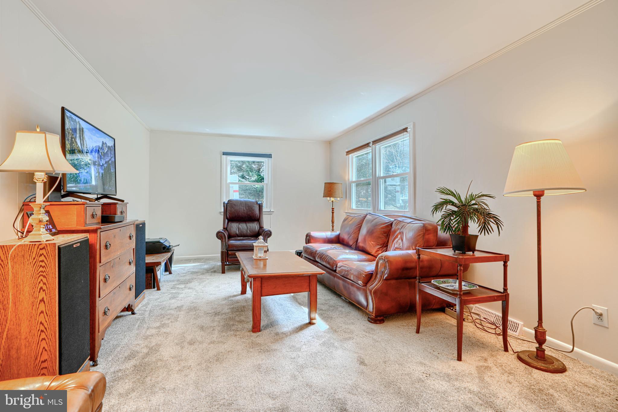 1202 Vermont Road Bel Air, MD 21014 - Photo 24 of 66 a living room with furniture a lamp and a window