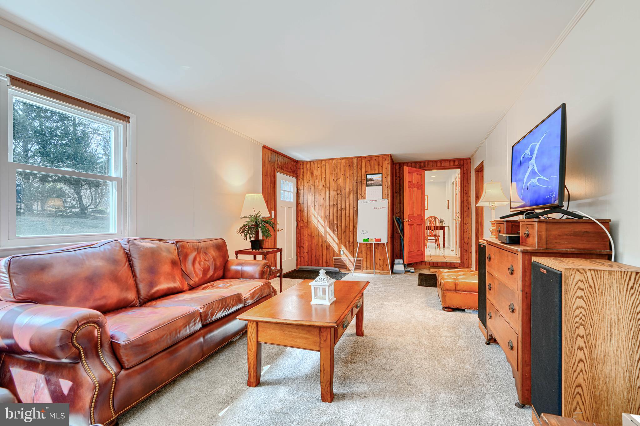 1202 Vermont Road Bel Air, MD 21014 - Photo 28 of 66 a living room with furniture a rug and a large window