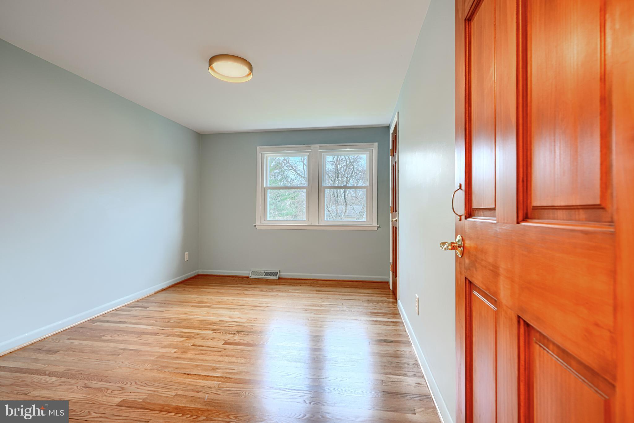 1202 Vermont Road Bel Air, MD 21014 - Photo 35 of 66 a view of hallway with window and wooden floor