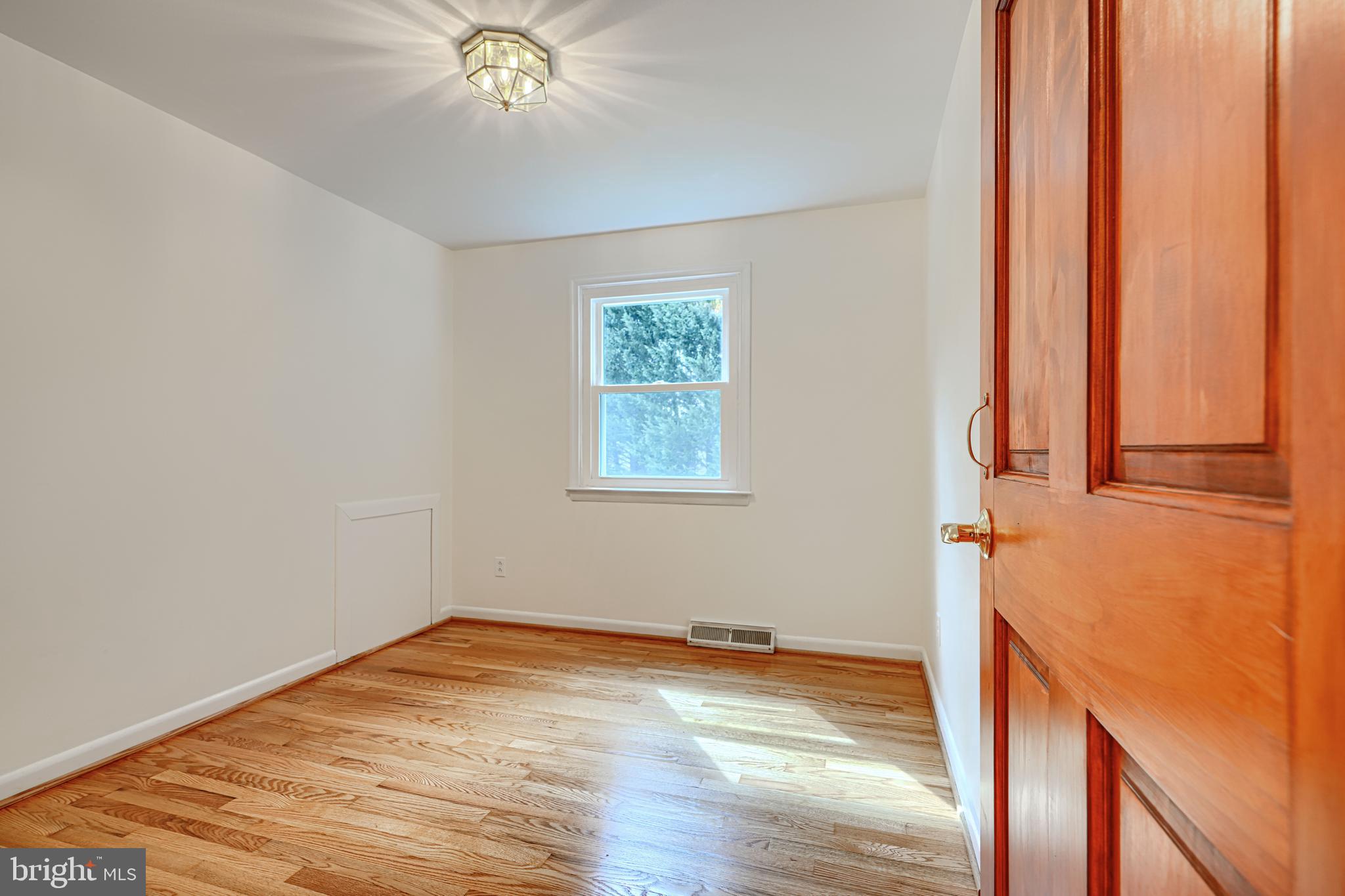 1202 Vermont Road Bel Air, MD 21014 - Photo 39 of 66 a view of empty room with window and wooden floor