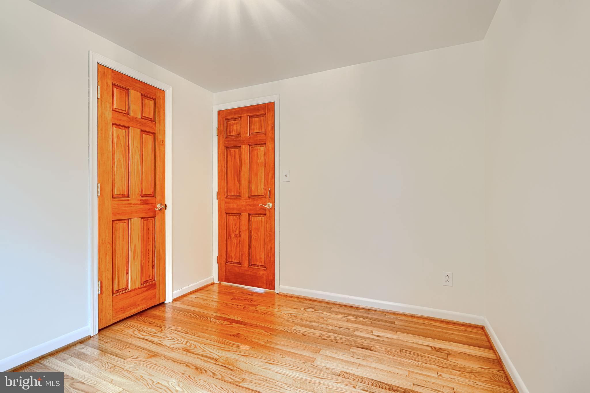 1202 Vermont Road Bel Air, MD 21014 - Photo 42 of 66 a view of an empty room with wooden floor and a window