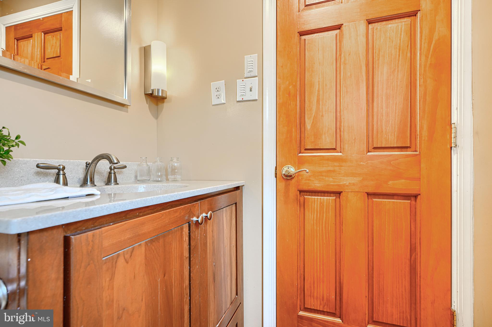 1202 Vermont Road Bel Air, MD 21014 - Photo 55 of 66 a kitchen with a sink a mirror and cabinets