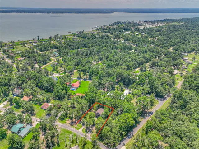 a backyard of a house with lots of green space and garage