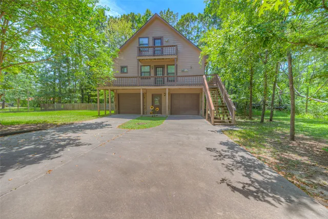 a house with huge green field in front of it