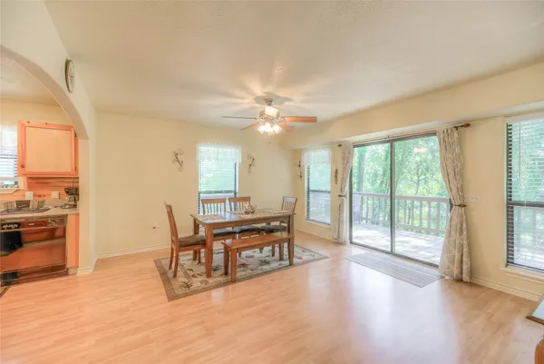 a view of a livingroom with furniture window and wooden floor