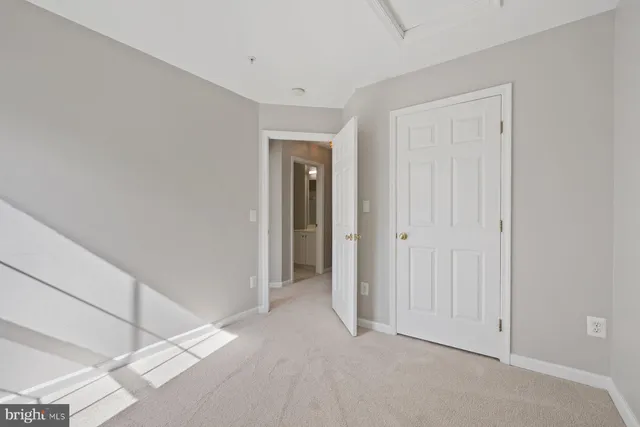 a bathroom with a tub a sink and mirror