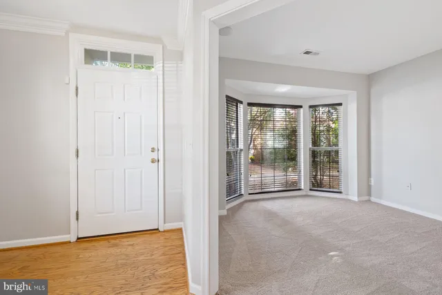 a view of an empty room with glass door