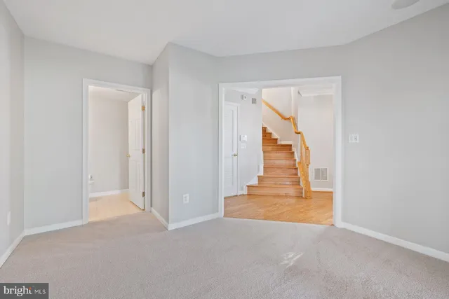 a view of an empty room with glass door
