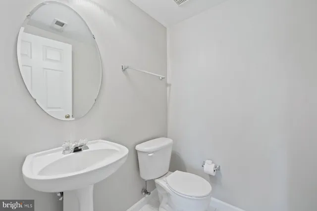 a view of a hallway with staircase