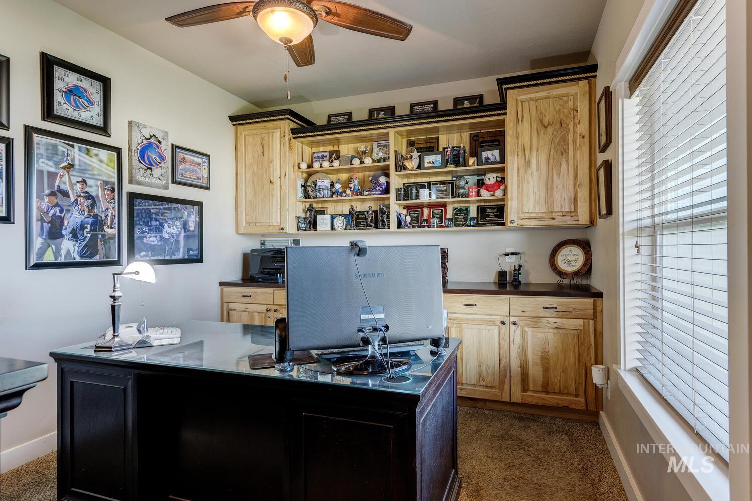 22757 Rosicky Way Caldwell, ID 83607 - Photo 24 of 50 Office space featuring healthy amount of natural light, a ceiling fan, and dark carpet