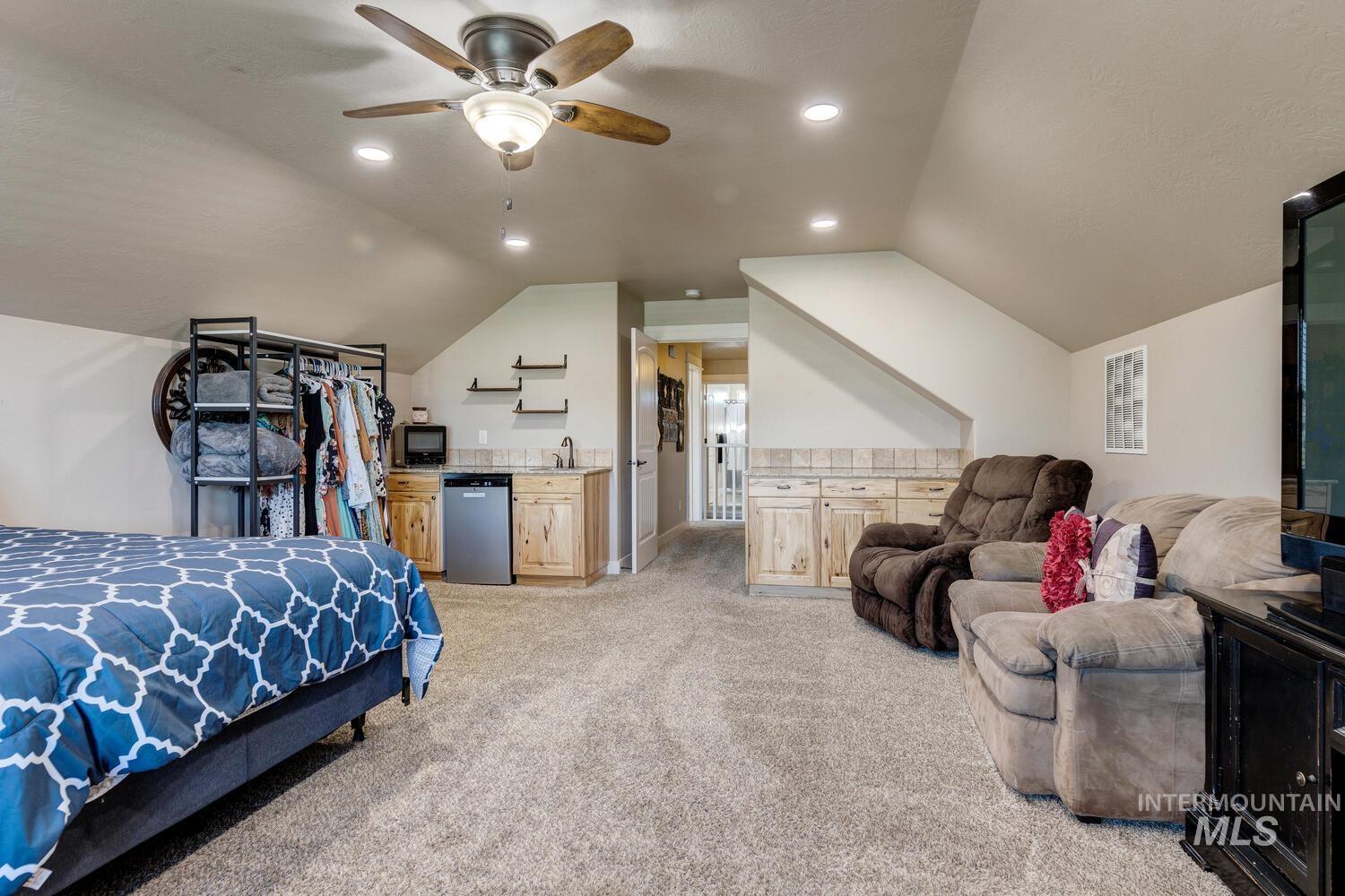 22757 Rosicky Way Caldwell, ID 83607 - Photo 29 of 50 Bedroom with light colored carpet, lofted ceiling, recessed lighting, and a ceiling fan