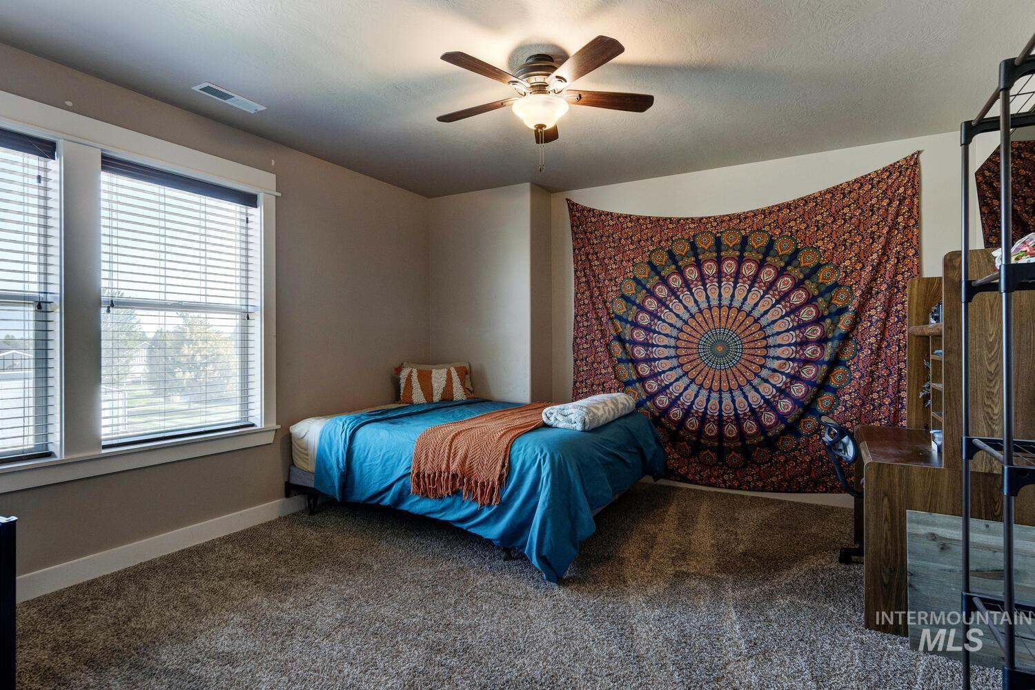 22757 Rosicky Way Caldwell, ID 83607 - Photo 30 of 50 Bedroom with carpet flooring and ceiling fan