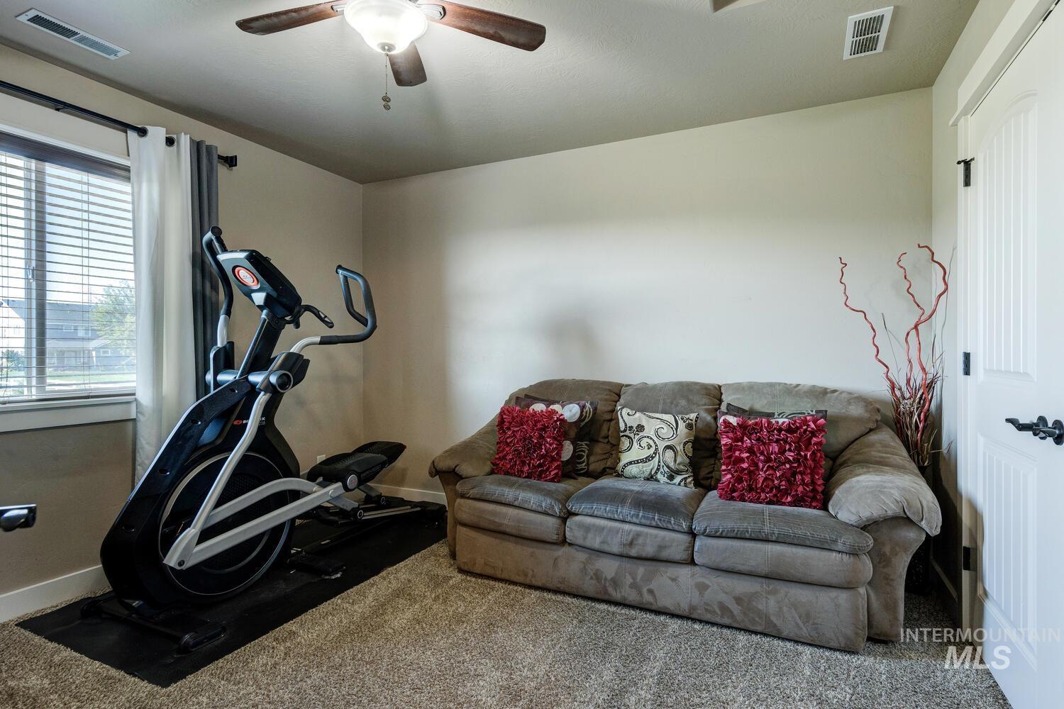 22757 Rosicky Way Caldwell, ID 83607 - Photo 35 of 50 Workout room featuring carpet floors and ceiling fan
