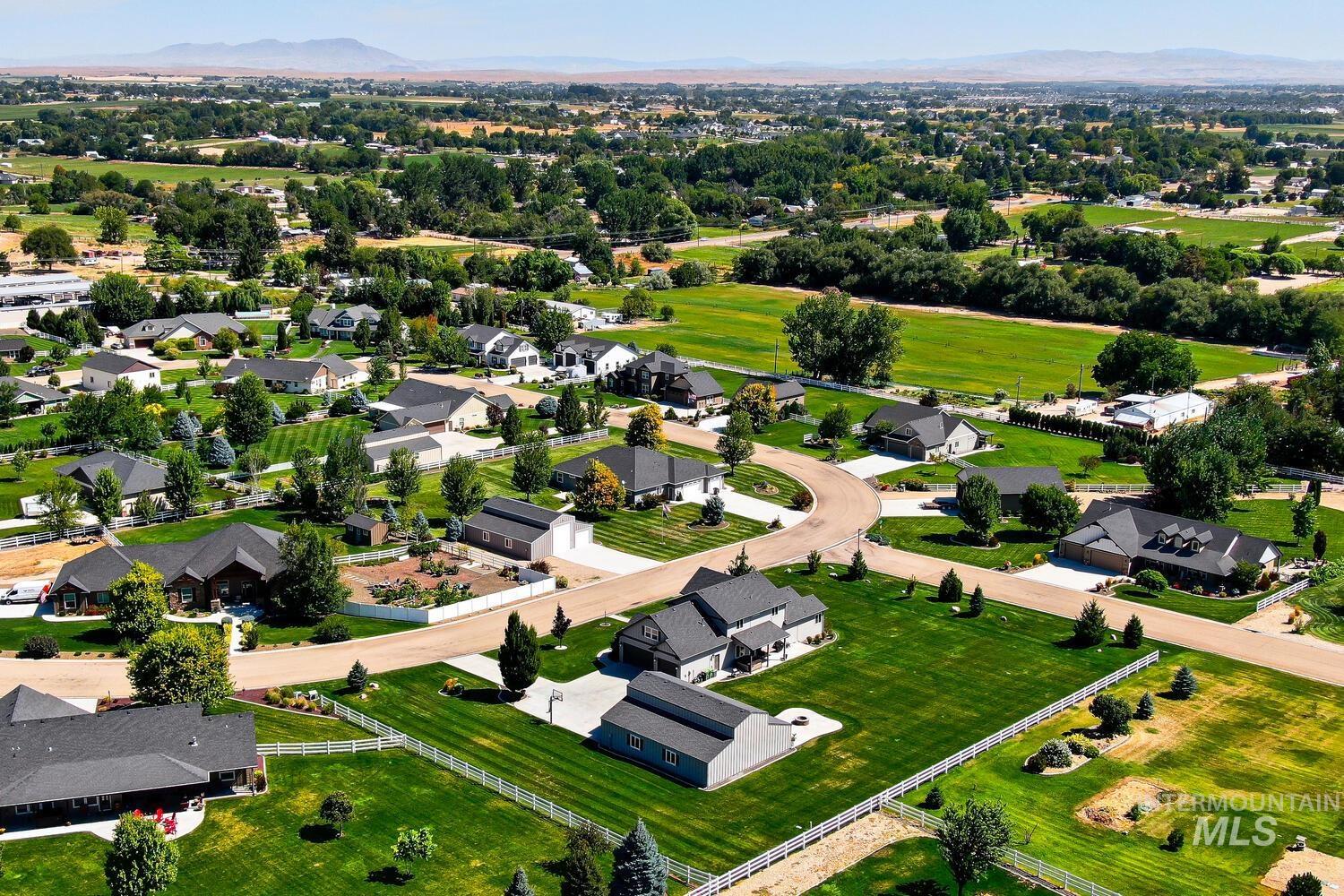 22757 Rosicky Way Caldwell, ID 83607 - Photo 47 of 50 Aerial view of residential area with a mountainous background