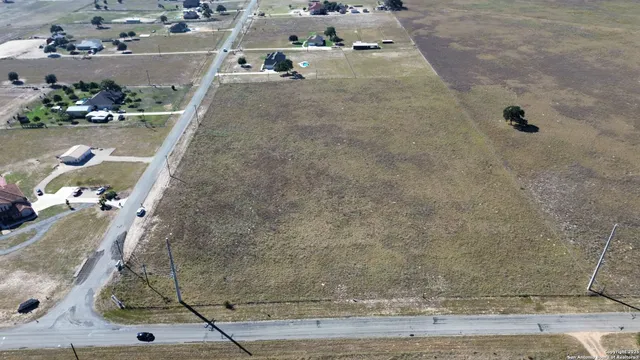 an aerial view of beach and residential space
